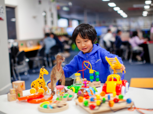 A child playing with toys at Brimbank Libraries